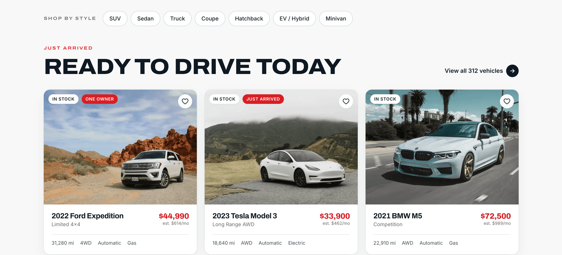 Dealership inventory listing page showing vehicle cards with price, mileage, and key specs